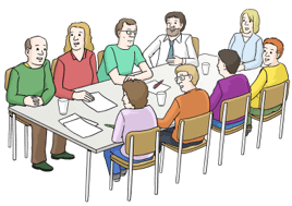 Viele Menschen sitzen um einen Konferenztisch und beraten sich.